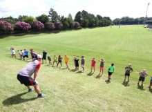 this is a photo of a coach training a group of endurance athletes